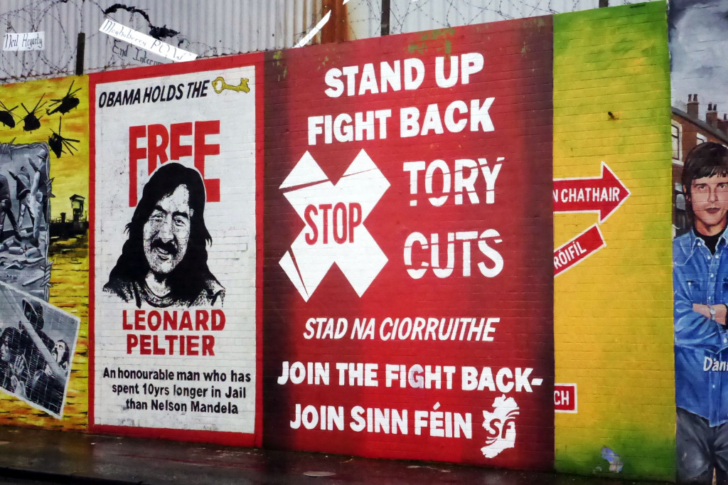 A mural complains of "tory cuts" in Belfast, Northern Ireland