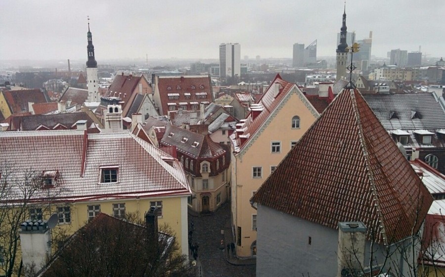 Light snow falls on the rooftops of Tallinn, Estonia