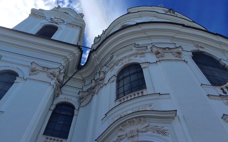 The pristine white facade of Dom du Salzburg, the city's cathedral