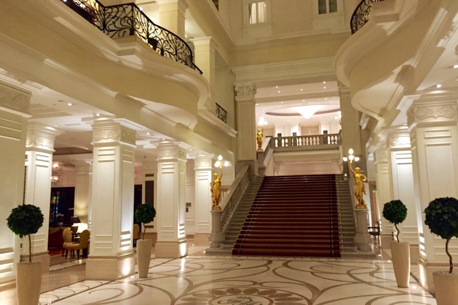 The grand staircase in the entrance hall of the Corinthia Hotel