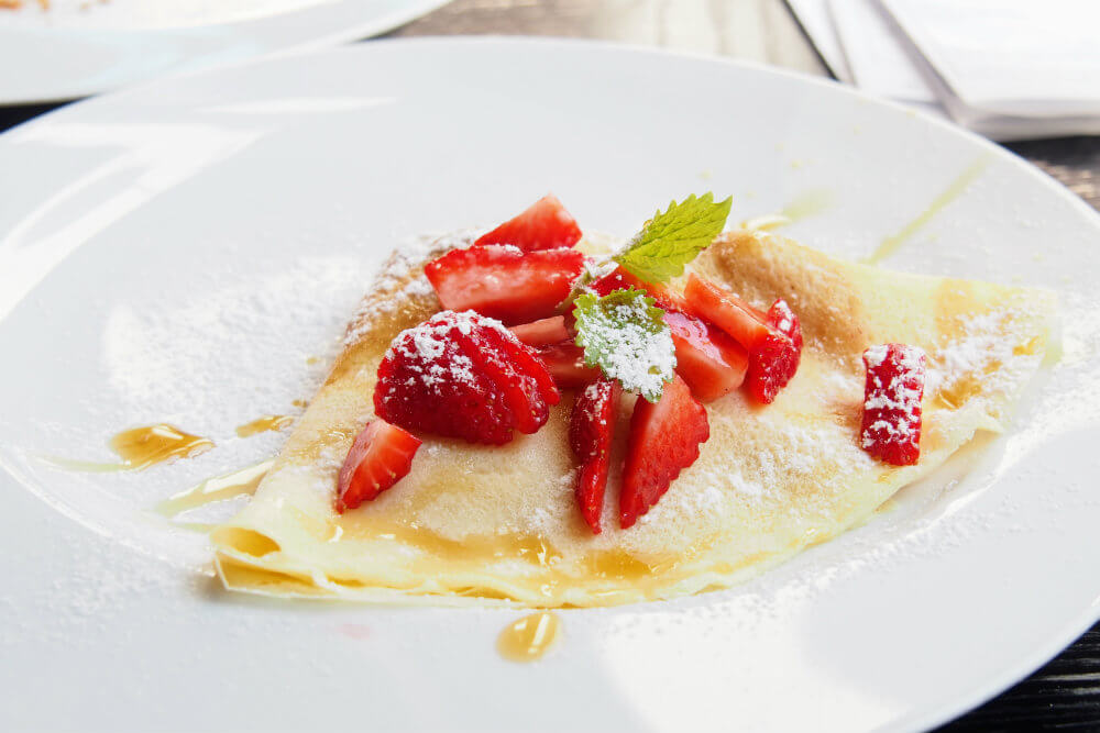 A crepe filled with mascarpone and topped with strawberries at Mr Cakes, Bratislava