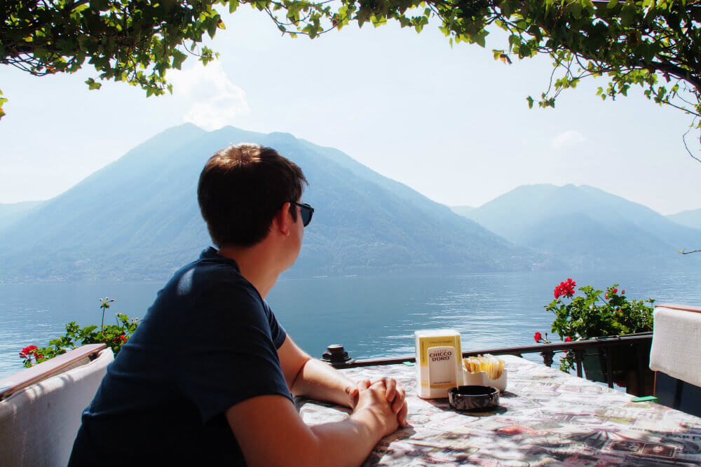 Gazing out over the sparkling waters of Lake Como in Argegno, Italy