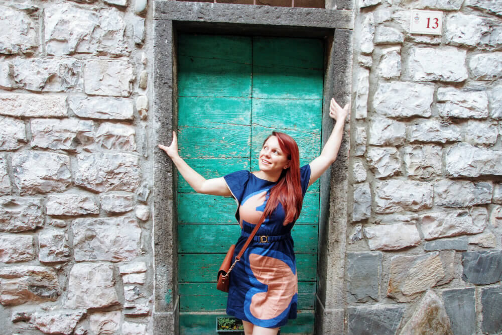 Jade glamorously props up a doorway in the quiet back streets
