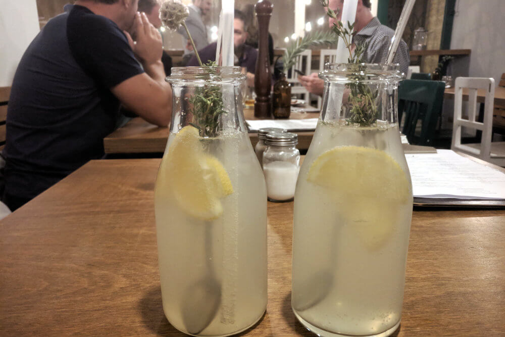 Homemade lemonades served with fresh sprigs of rosemary at Soul Bistro, Brno