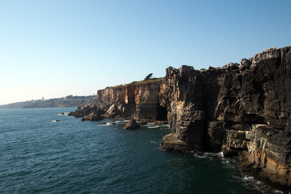 Rocky cliffs meet the Atlantic Ocean along the Cascais shoreline