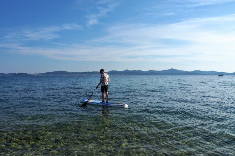 Cautiously paddling amidst the crystal clear waters of the Adriatic