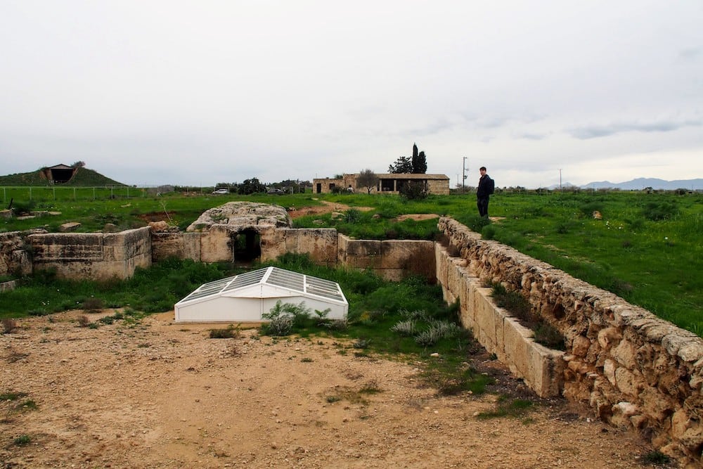 Matt surveys one of the tombs. Underneath the white housing is the remains of a horse