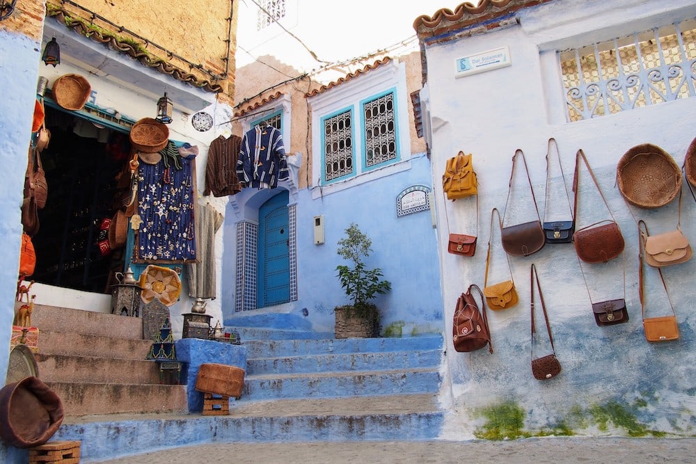 Locally-crafted handbags for sale on the narrow streets of Chefchaouen