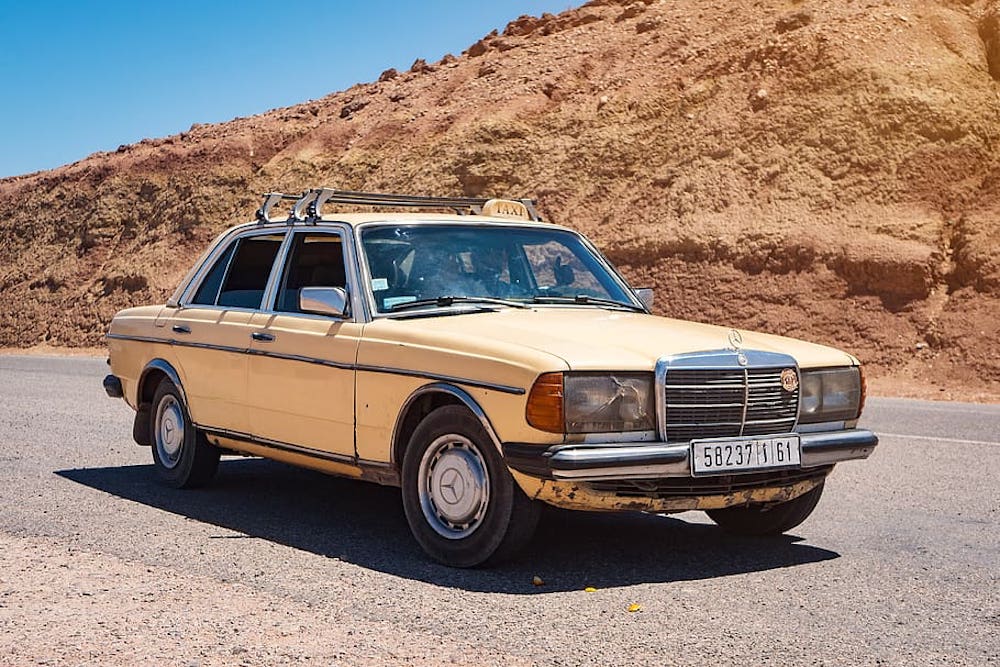 While there are more modern grand taxis, some are still ageing, cream coloured Mercedes like this one.