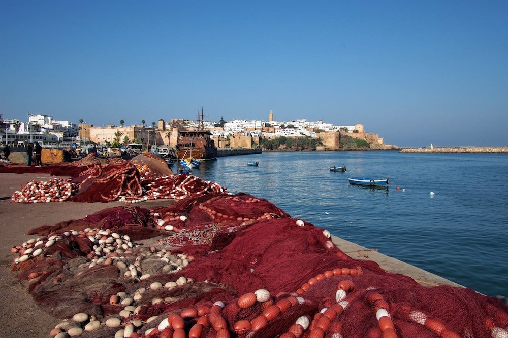 Fishing nets rest on the water's edge in Rabat, Morocco