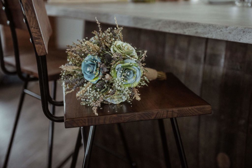 Jade's home-made bouquet rests on a bar stool