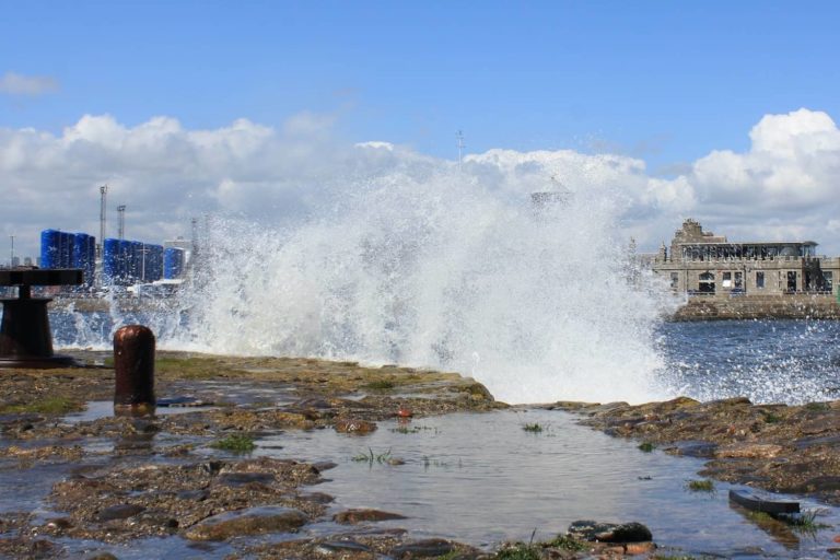 Waves crash over the shoreline in Greyhope, Aberdeen