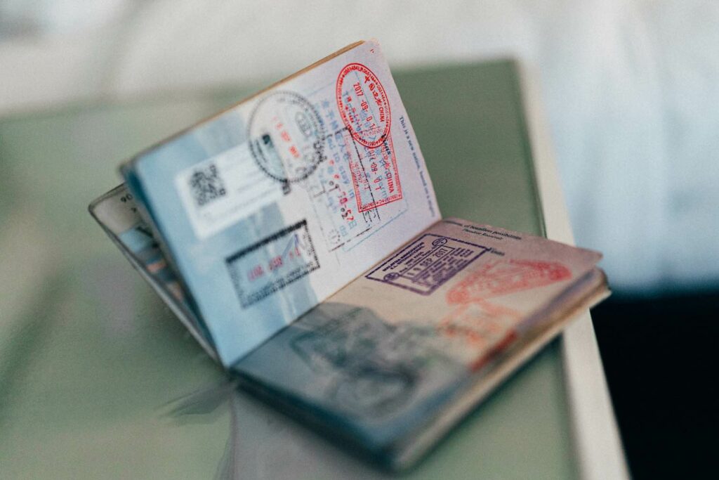 An open passport showing stamps from all over the world