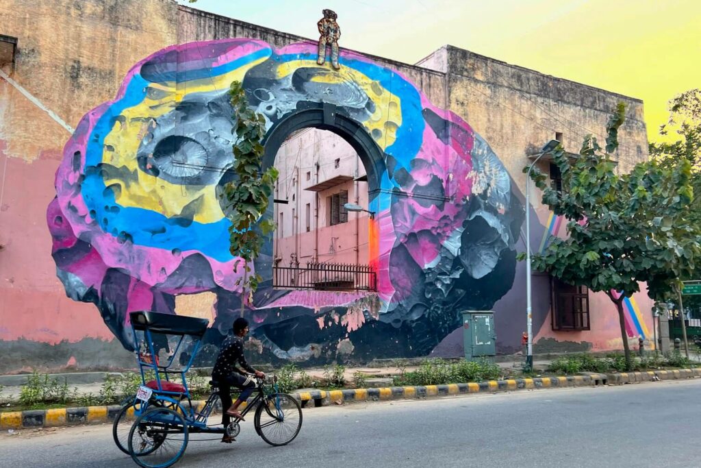 A multi-coloured space themed mural in Lodhi Art District