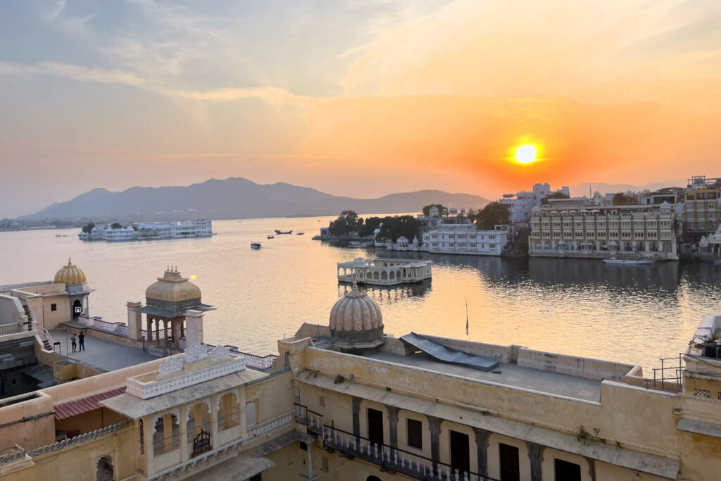 Lake Pichola at sunset, as seen from a rooftop cafe in Udaipur, India